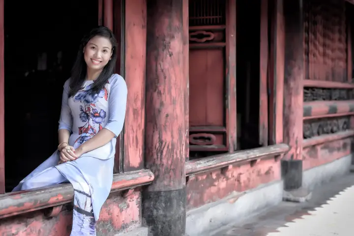 Visitors in áo dài at the Temple of Literature, Hanoi