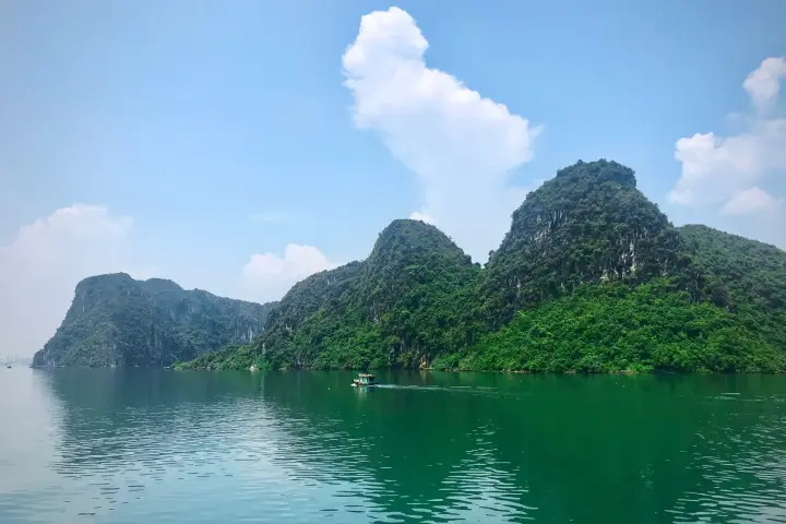 Green islets and blue water in Hạ Long Bay