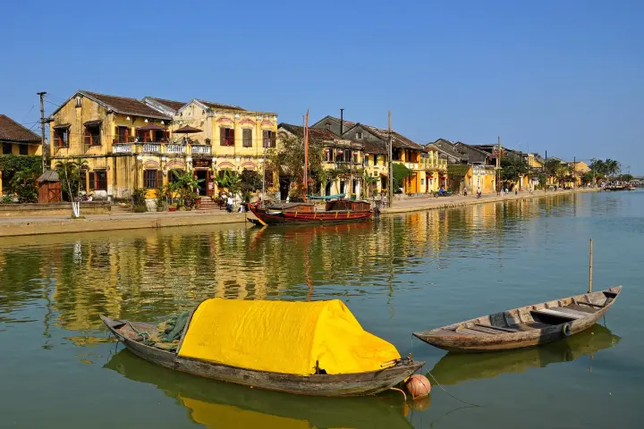Yellow houses and boats on the Thu Bồn River, Hội An