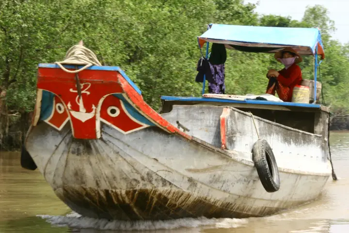 A painted boat on the Mekong River at Vĩnh Long